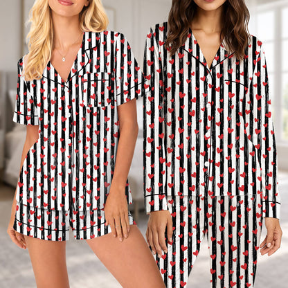 Family enjoying time together in matching striped heart pajamas