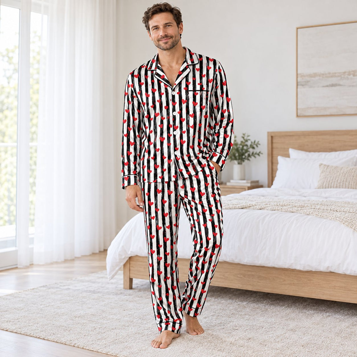 Close up lifestyle view of black and white striped pajama set with red hearts