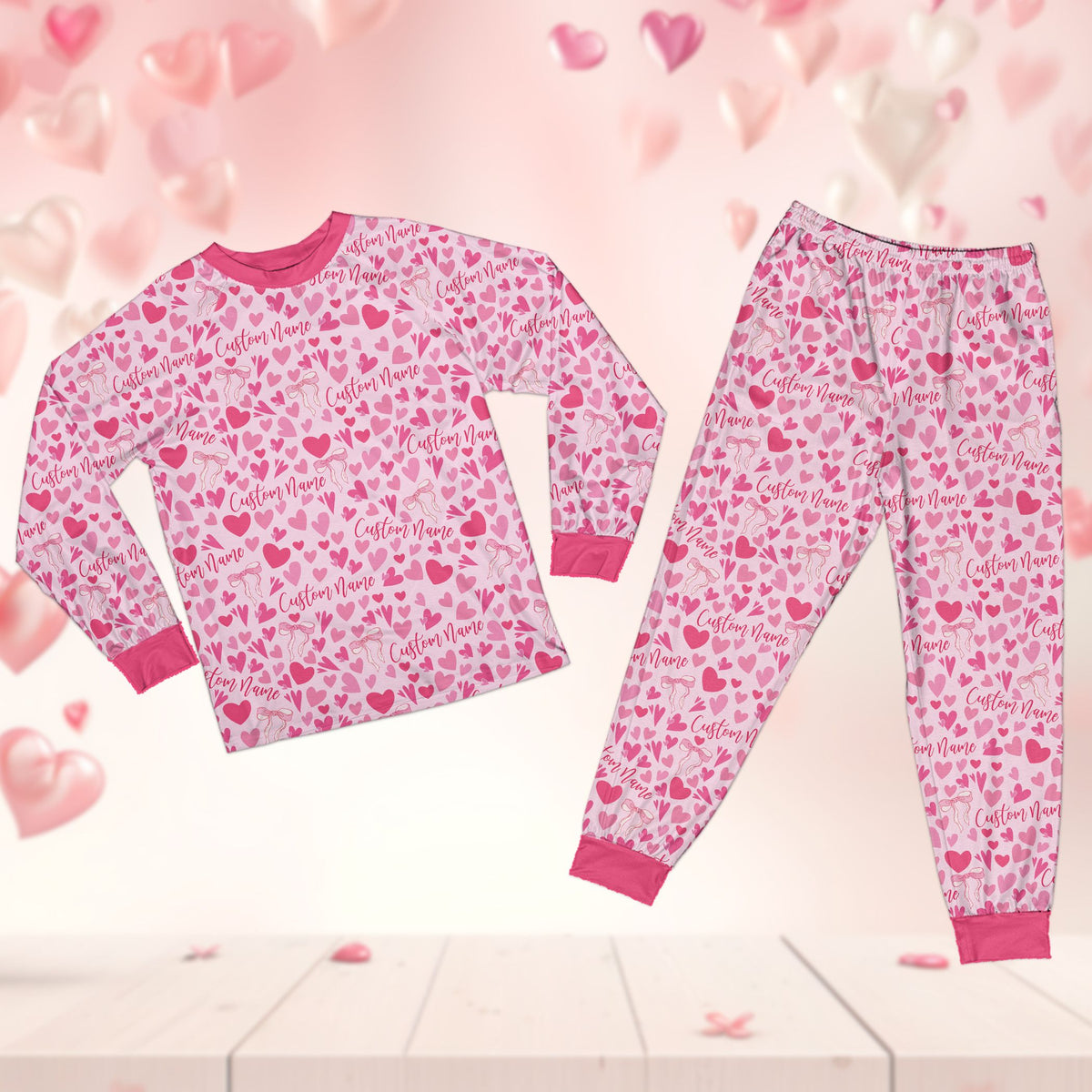 Matching family pajama set with hearts and bows pattern, front view 2