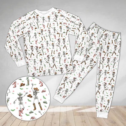 Close up of dancing skeletons on western halloween pajama set