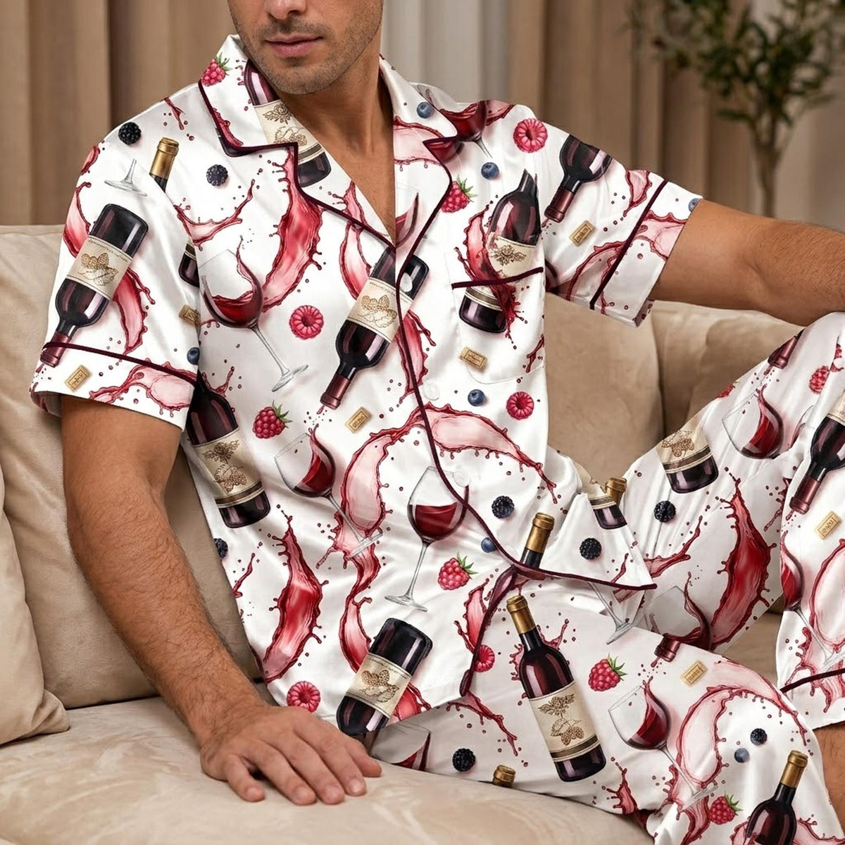 Front view of matching family pajamas featuring red wine liquid and berries