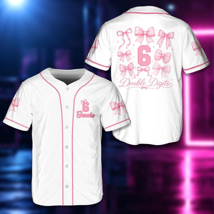 Personalized white birthday baseball jersey featuring pink bows and a custom name and number, front view.