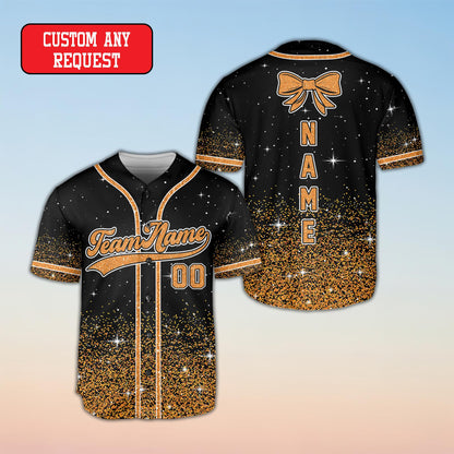 Close-up of the silver glitter gradient detailing on the bottom of the black baseball jersey