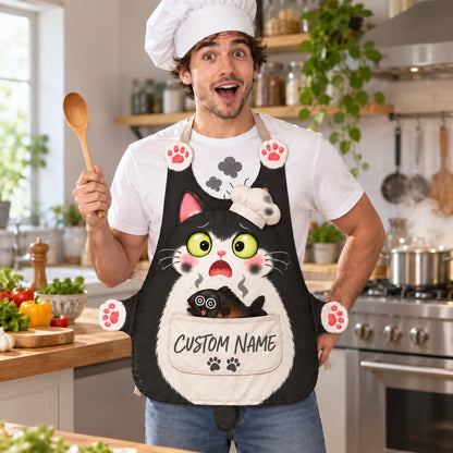 Personalized cat apron with custom name on the pocket, black tuxedo cat, Burnt Chef design: a shocked cat with a sooty chef hat and a burnt smoking fish in the pocket