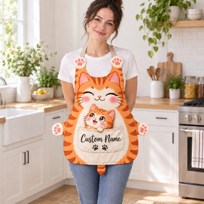 Personalized cat apron with custom name on the pocket, orange tabby cat, Mama & Kitten design: a smiling mama cat with a tiny kitten peeking out of the pocket