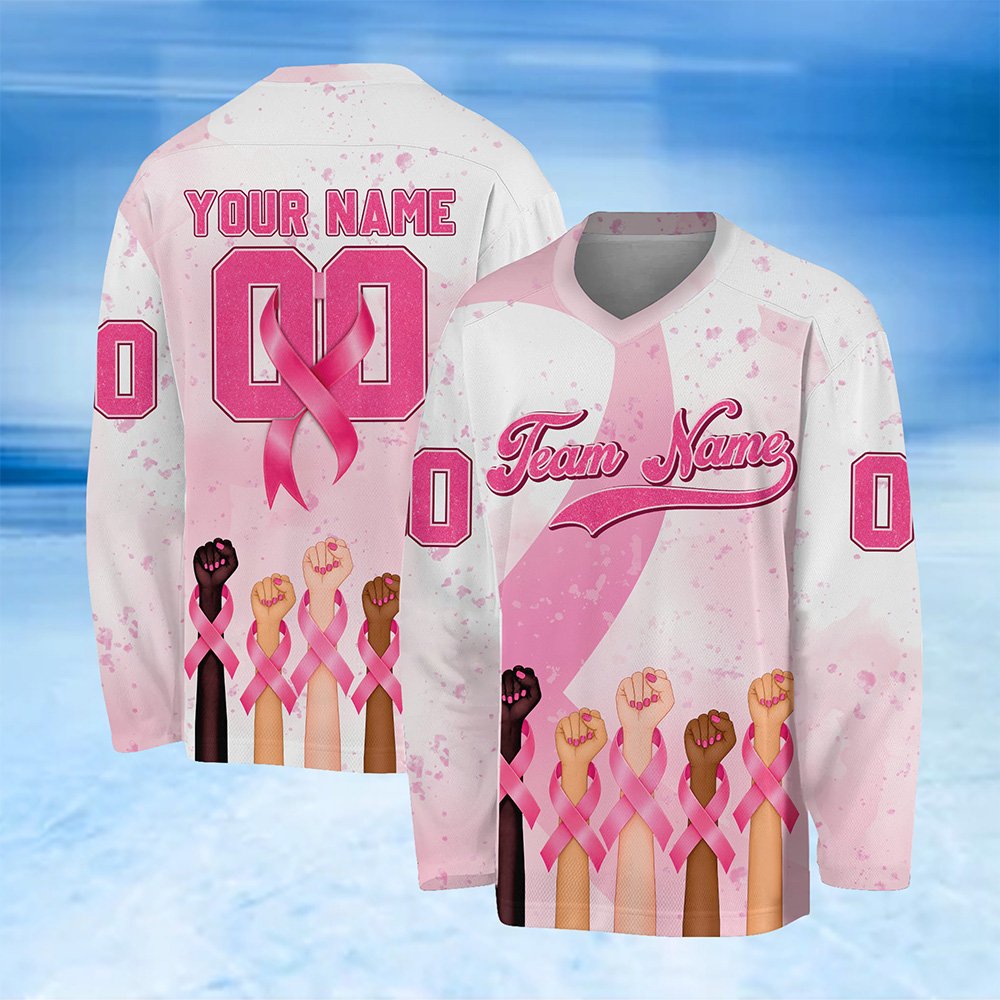 White pink breast hockey jersey with raised fists and pink ribbon design, front view