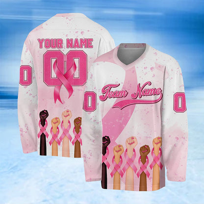 White pink breast hockey jersey with raised fists and pink ribbon design, front view