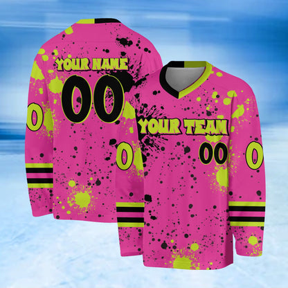 Main view of a personalized pink paint splatter hockey jersey with custom name and number