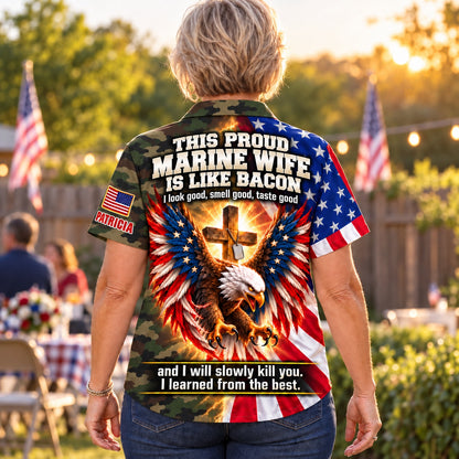 Back of the personalized This Proud Marine Wife Is Like Bacon Hawaiian shirt: woodland camo body, American flag eagle with glowing cross and dog tags, custom name under the flag patch on the sleeve