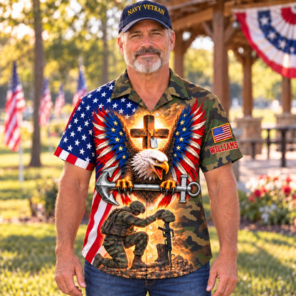 Front of the personalized Navy veteran camo Hawaiian shirt: American flag eagle with a steel anchor, glowing cross with dog tags and a kneeling sailor at a battlefield cross, custom name on the sleeve