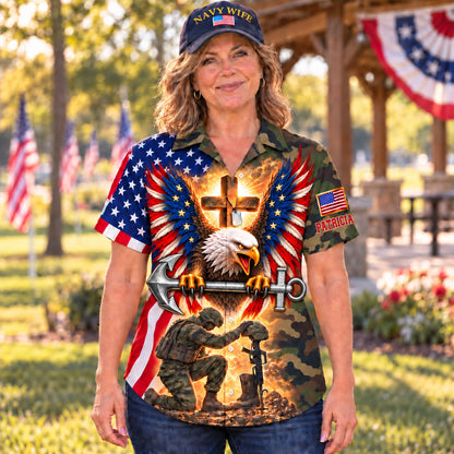 Front of the personalized Navy wife Hawaiian shirt: American flag eagle with a steel anchor, glowing cross with dog tags and a kneeling sailor at a battlefield cross on a camo body, custom name on the sleeve