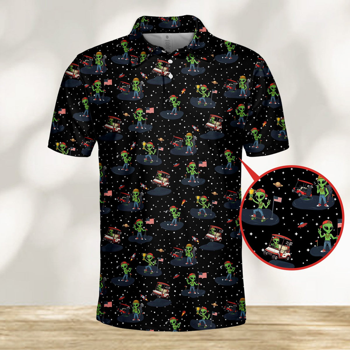 Alien golf polo shirt featuring green extraterrestrials on a starry black background, front view