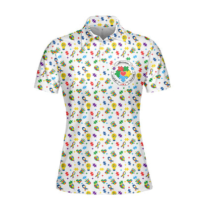 White autism awareness polo shirt with colorful puzzle pieces and ribbons, front view