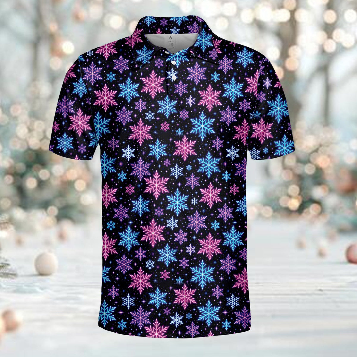 Festive pink and blue snowflake polo, front view