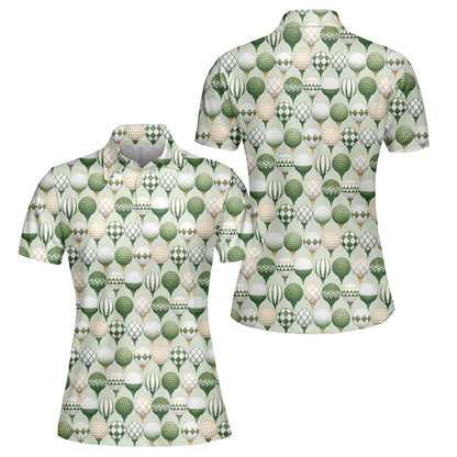 Green golf polo shirt featuring geometric golf balls on tees, front view