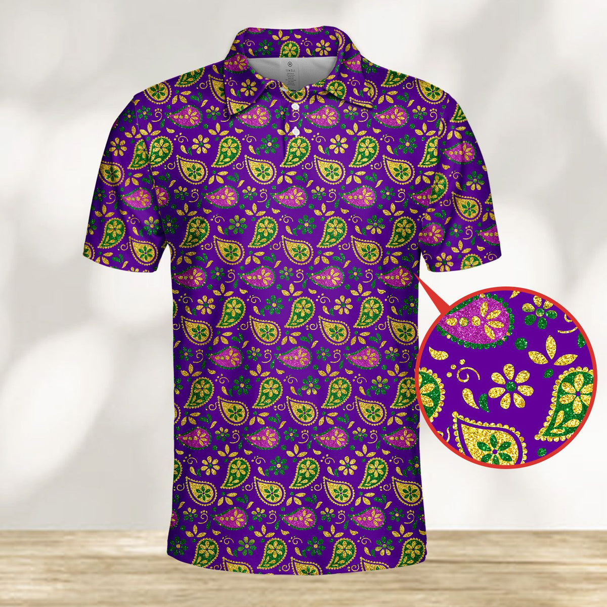Detailed front view of the purple and gold paisley polo shirt