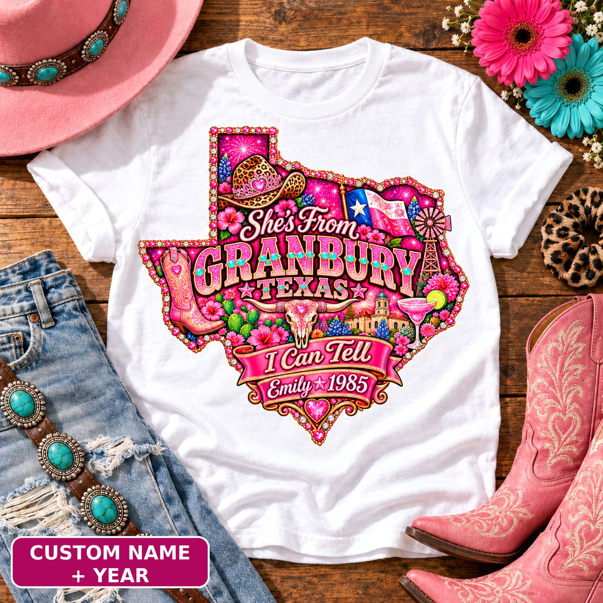 Personalized She's From Granbury Texas I Can Tell t-shirt on White, custom name and year badge, pink glitter Texas with rhinestone border, leopard cowgirl hat, flag, boots, longhorn and custom name and year banner NEW2