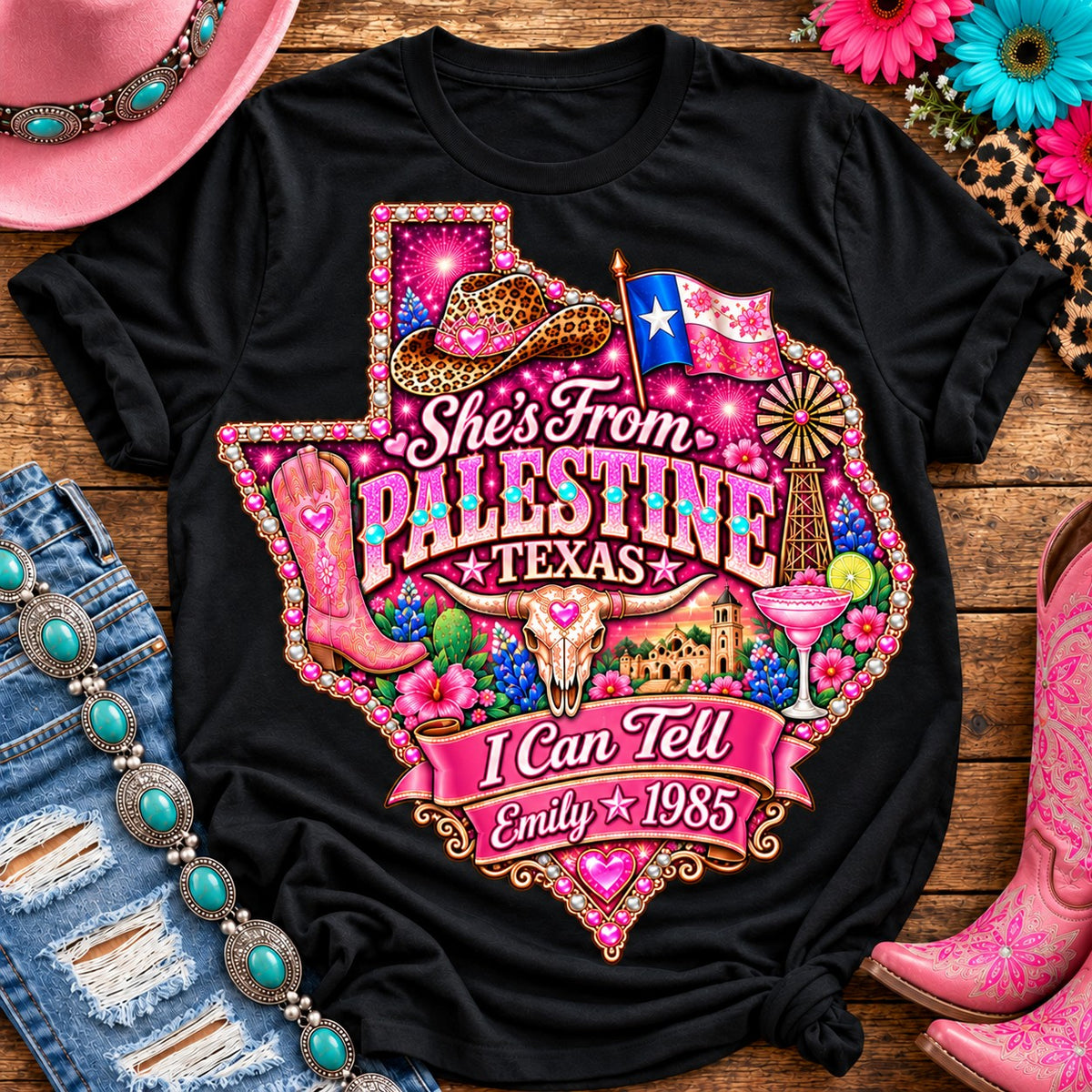 Personalized She's From Palestine Texas I Can Tell t-shirt on Black with pearl and heart border, pink glitter Texas with rhinestone border, leopard cowgirl hat, flag, boots, longhorn and custom name and year banner NEW2