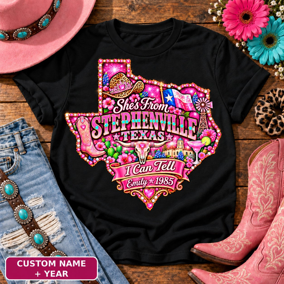 Personalized She's From Stephenville Texas I Can Tell t-shirt on Black, custom name and year badge, pink glitter Texas with rhinestone border, leopard cowgirl hat, flag, boots, longhorn and custom name and year banner NEW2