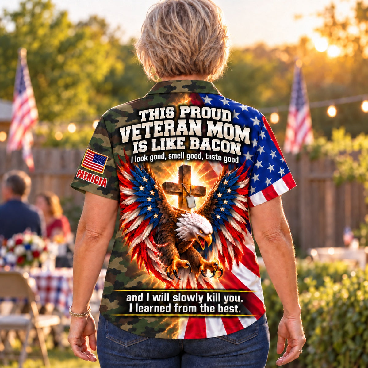Back of the personalized This Proud Veteran Mom Is Like Bacon Hawaiian shirt: woodland camo body, American flag eagle with glowing cross and dog tags, custom name under the flag patch on the sleeve