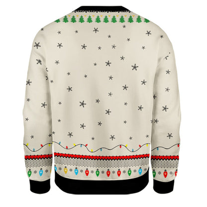 Close-up back view of the fair isle string lights and snowflake pattern on the sweater