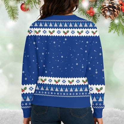 Lifestyle view of an adult wearing the blue ugly Christmas sweater