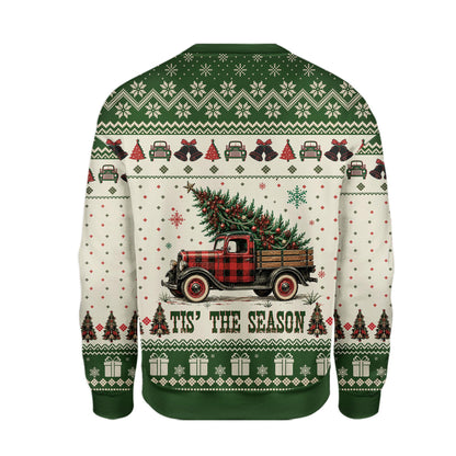 Beige Christmas ugly sweater featuring a vintage red truck carrying a Christmas tree, back view