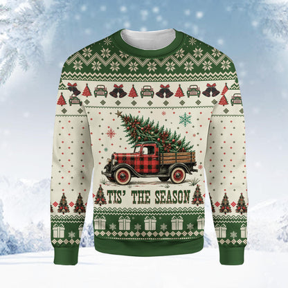 Beige Christmas ugly sweater featuring a vintage red truck carrying a Christmas tree, front view close up
