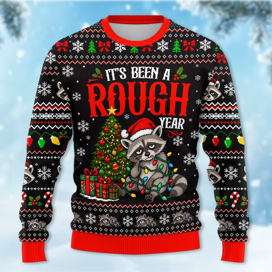 Funny ugly sweater featuring a grumpy raccoon and It's Been A Rough Year text, front view