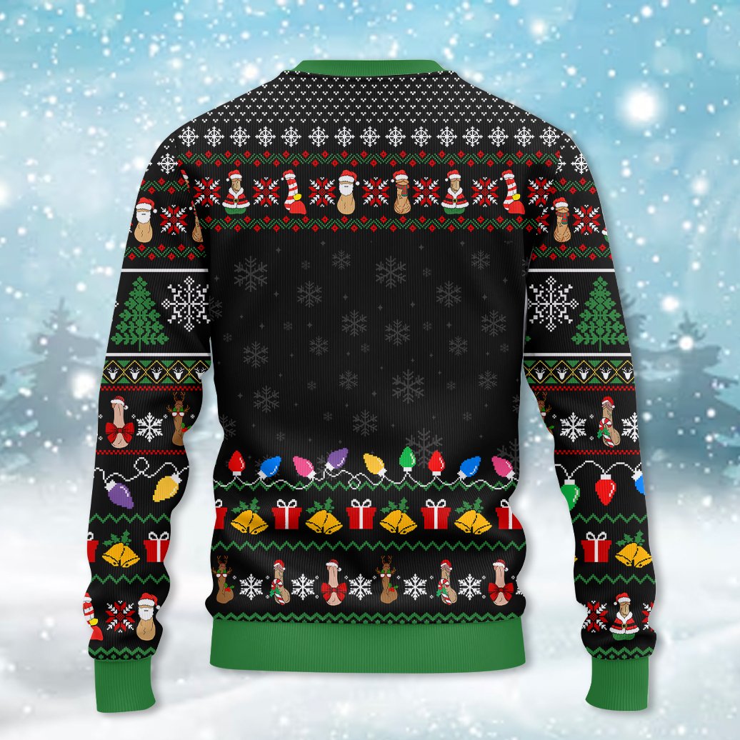 Back view of the black ugly sweater with green cuffs and holiday pattern