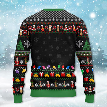 Back view of the black ugly sweater with green cuffs and holiday pattern