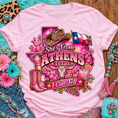 She's From Athens Texas I Can Tell pink cowgirl t-shirt, galaxy Texas, leopard hat, boots and longhorn design on a Blossom Comfort Colors 1717 tee
