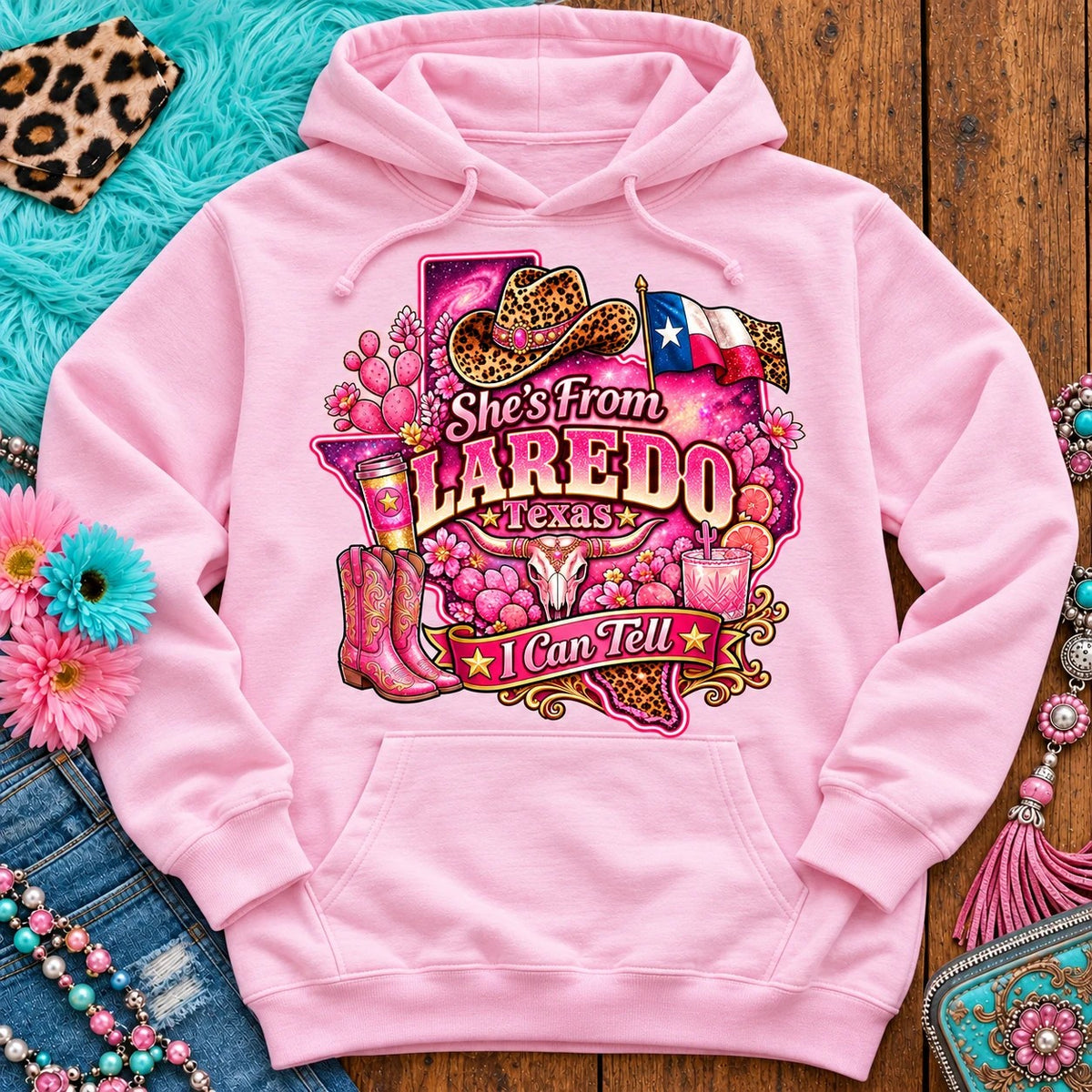 She's From Laredo Texas I Can Tell pink cowgirl hoodie, galaxy Texas, leopard hat, boots and longhorn design on Light Pink