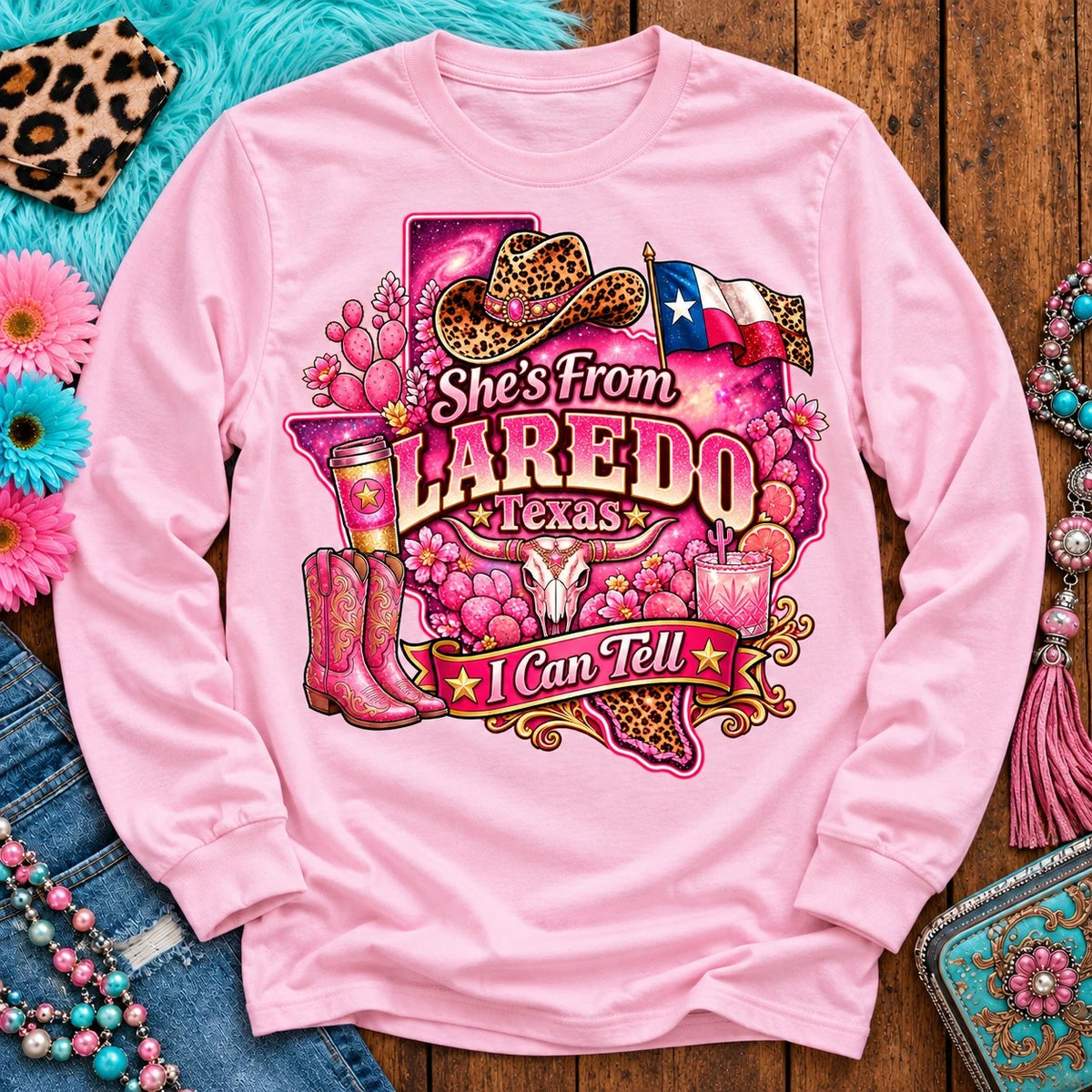 She's From Laredo Texas I Can Tell pink cowgirl long sleeve, galaxy Texas, leopard hat, boots and longhorn design on Light Pink