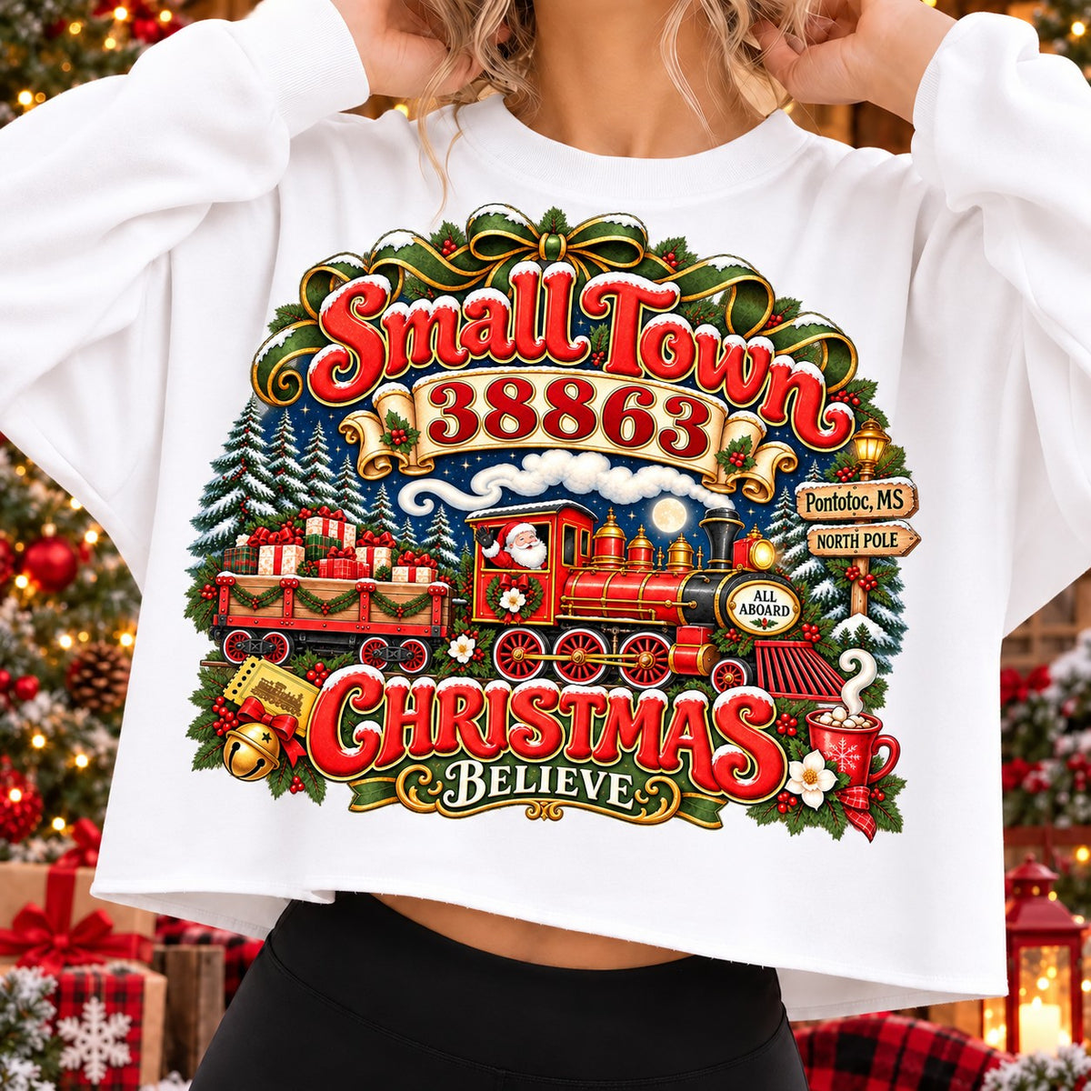 Small Town 38863 Christmas Believe sweatshirt on White, Santa steam train, gifts, snowy pines and Pontotoc, MS signpost (pontotoc-ms-38863)