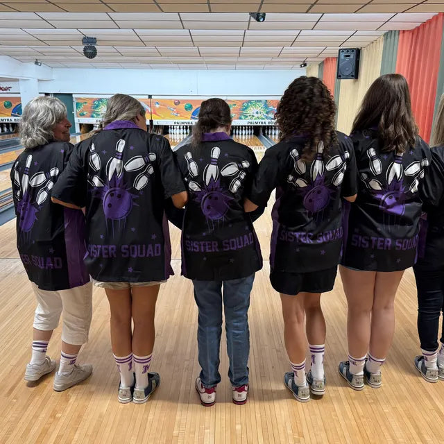 Group wearing matching bowling shirts